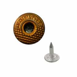 a brass jeans buttons with a nail