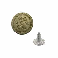 a brass jeans buttons in dull nickle color with a nail