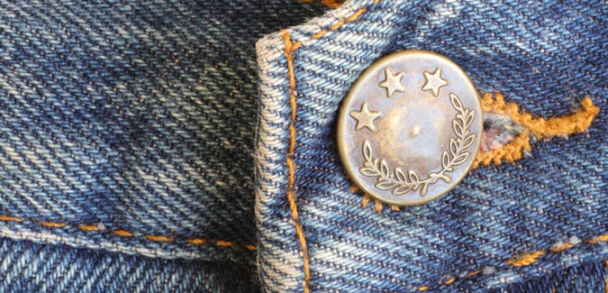 iron jeans buttons attached on a denim